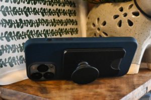 The PopSockets Wallet for MagSafe is an excellent stand for even the big iPhone 13 Pro Max. Popsockets wallet for magsafe on the back of an iPhone 13 pro max