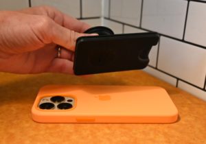 The magnetic bond is strong but it's still easy to take the Popsocket wallet for MagSafe off of your phone if you need to use the MagSafe for something else. Popsockets wallet for magsafe magnetically sticking to an iPhone 13
